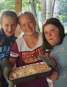 Girls showing what they baked at Caddoodles camp