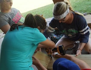 Girls learning carpentry skills