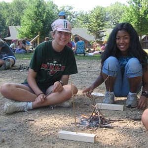 Girls building a fire