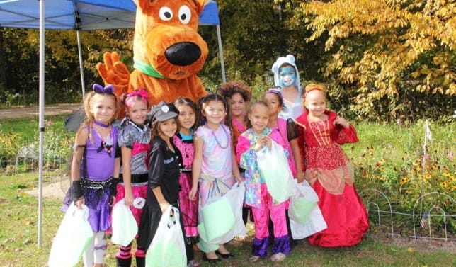 Girls in costume pose with Scooby Doo at Spookamaga